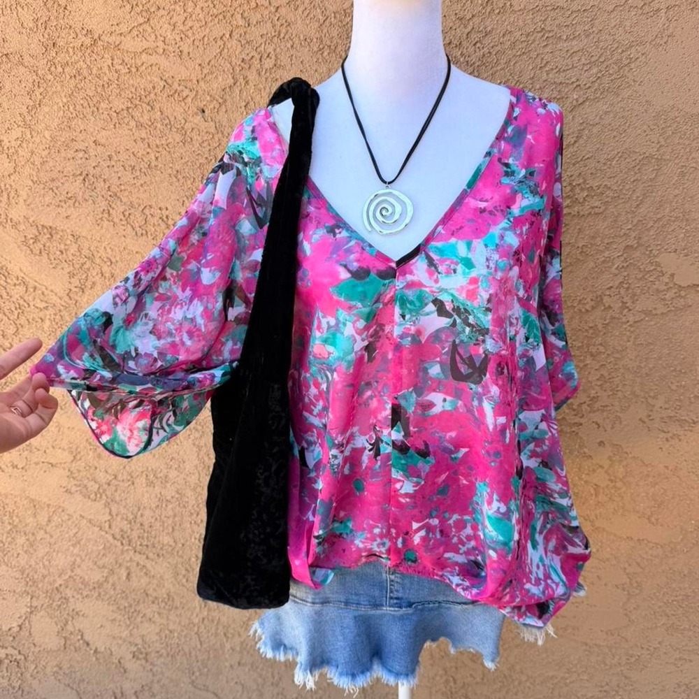 Bisou Bisou pink floral poncho blouse.